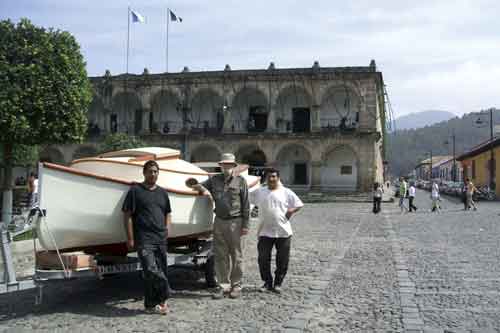 The author and two La Antigua cabinet makers turned boat builders next to the catboat at central park, La Antigua